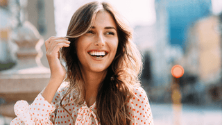 Happy woman in stylish outfit