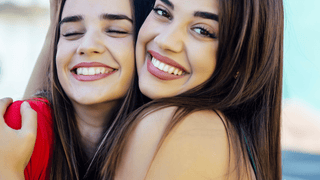 Two smiling women