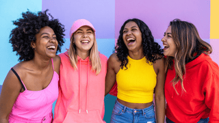Group of women smiling and laughing together