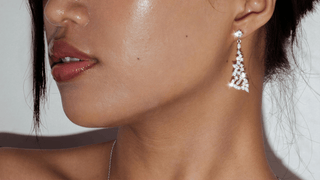 Woman wearing sparkly silver earrings