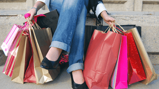 Woman holding colorful shopping bags