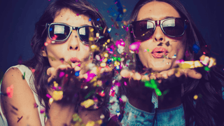 Friends spreading confetti