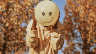 Woman holding balloon