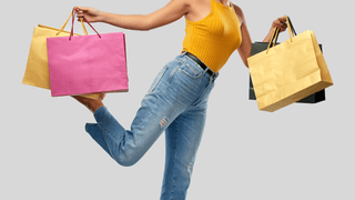 Woman holding colorful shopping bags