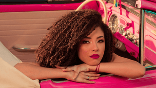 Woman in hot pink car