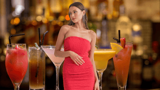 Woman wearing red dress at a Lake Geneva bar