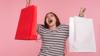 Woman holding boutique shopping bags