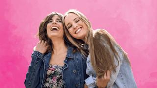 Female friends laughing and smiling