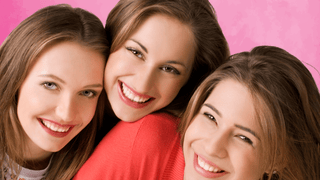 Three women smiling