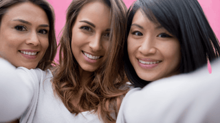 Three women posing for a selfie