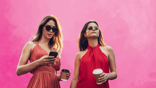Two trendy women in cute boutique dresses