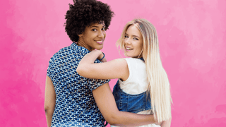 Two female friends smiling