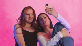 Female friends taking a cute selfie