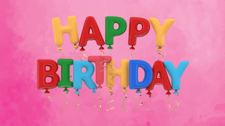 Colorful happy birthday balloons on a pink backdrop