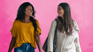 Two female friends smiling