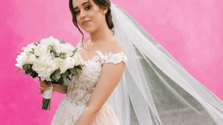 Bride in front of pink background