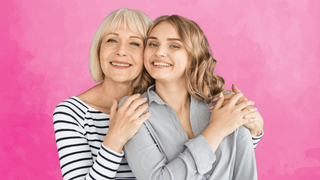 Mother and daughter smiling