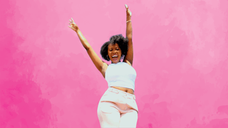 Woman with her arms in the air and a happy expression
