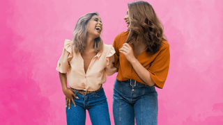 Two women laughing hysterically