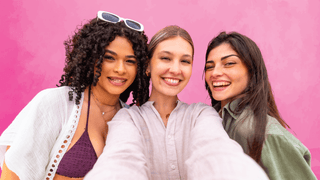 Women smiling for a photo together