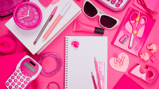 A variety of bold pink items in a girly aesthetic