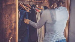 Woman looking into a closet
