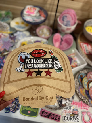 Hat board with patches laid out on top of it